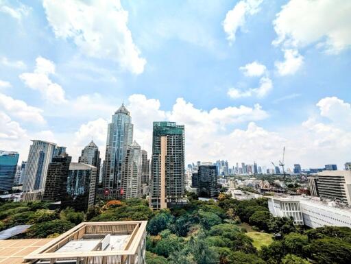 City skyline view with high-rise buildings and greenery