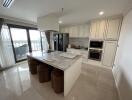 Modern kitchen with white cabinetry and marble island