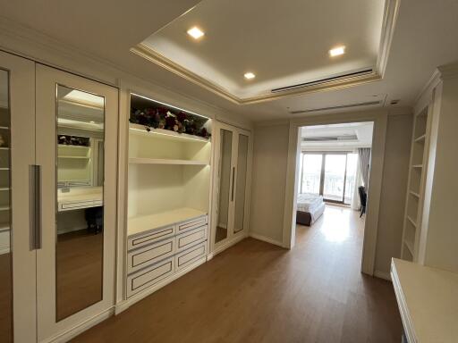 Spacious bedroom with built-in wardrobes and a view of the exterior