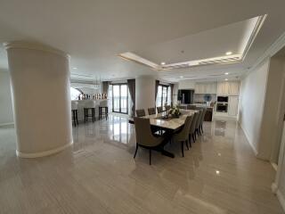 Spacious and modern dining area with elegant furnishings and a bar