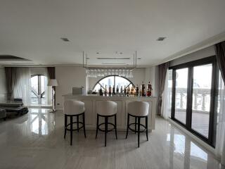 Modern living room with bar area and city view