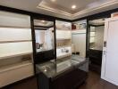 Well-organized closet with built-in shelves and mirrored doors