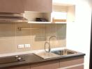 Modern kitchen with brown cabinets and stainless steel sink