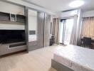 Modern bedroom with large wardrobe and balcony access