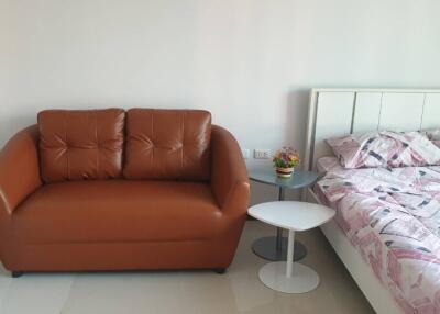 Bedroom with a brown sofa