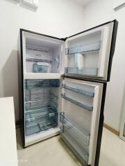 Open refrigerator with visible shelves and compartments