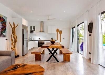 Modern kitchen and dining area with wooden furnishings