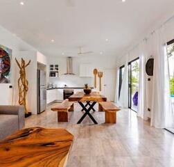 Modern kitchen and dining area with wooden furnishings