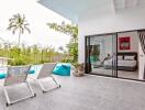 Modern patio area with poolside view and adjacent bedroom