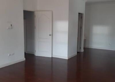 Main living area with hardwood floors and doorways