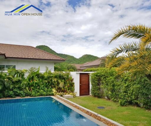 Outdoor view of a house with a swimming pool