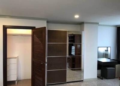 Spacious bedroom with closet and study area