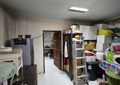 Utility room with storage and appliances