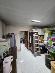 Utility room with storage and appliances