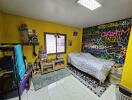 Colorful bedroom with graffiti wall, single bed, and window