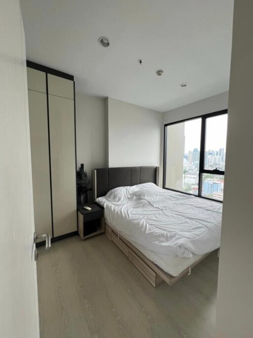 Modern bedroom with a city view