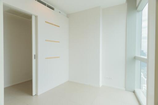 Minimalist empty bedroom with large window