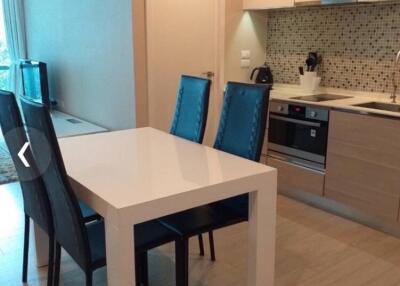 Modern kitchen with dining table and four chairs