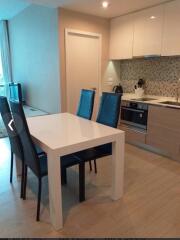 Modern kitchen with dining table and four chairs