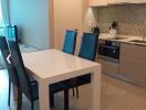 Modern kitchen with dining table and four chairs