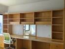 Bedroom with study area featuring built-in shelves and desk