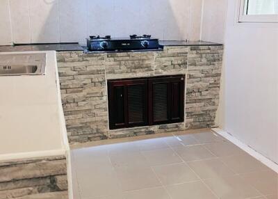 Modern kitchen with tiled walls and built-in stove