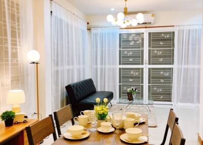 Modern living room with dining area and furniture