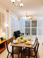 Modern living room with dining area and furniture