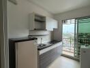 Modern kitchen with balcony view