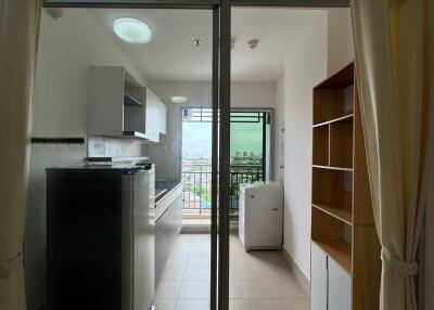 Modern kitchen with sliding glass door and balcony view