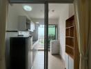 Modern kitchen with sliding glass door and balcony view