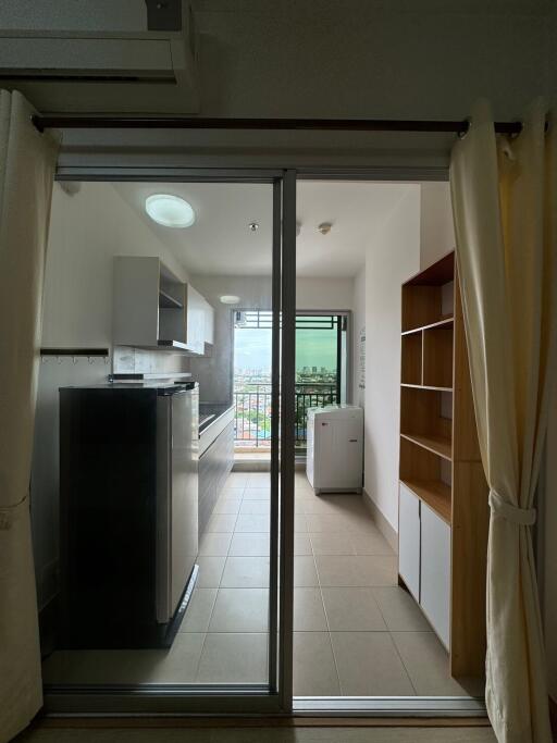 Modern kitchen with sliding glass door and balcony view