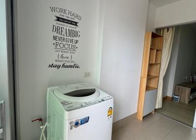 Laundry area with washing machine and storage space