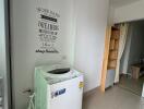 Laundry area with washing machine and storage space