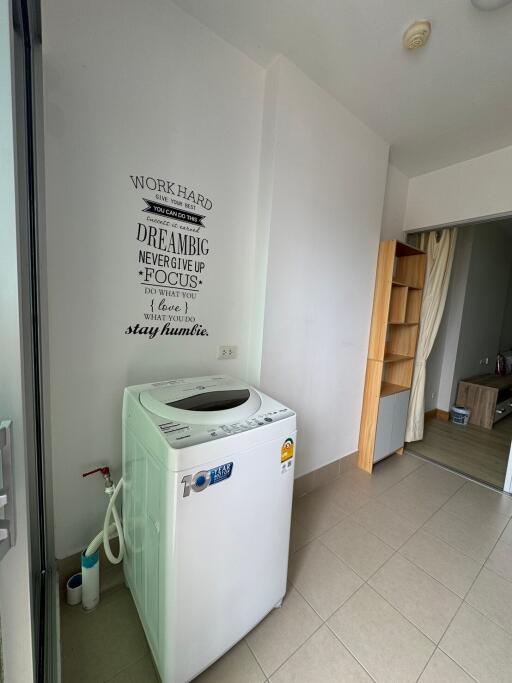 Laundry area with washing machine and storage space