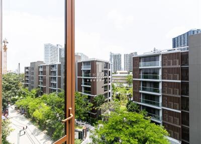 View of modern residential buildings and greenery from a high vantage point