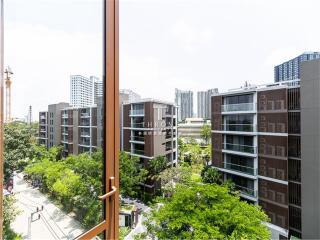 View of modern residential buildings and greenery from a high vantage point