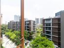 View of modern residential buildings and greenery from a high vantage point