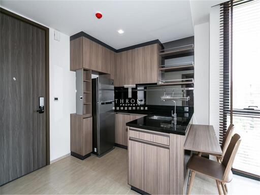 Modern kitchen with wooden cabinets and dining area