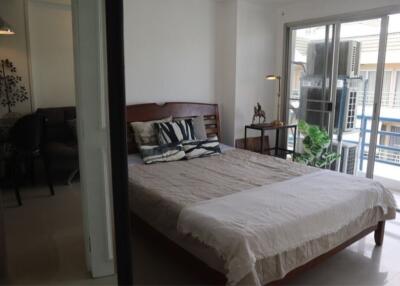 Bedroom with balcony access and modern decor