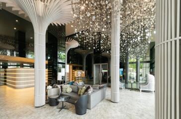 Modern lobby with stylish seating and unique lighting fixtures