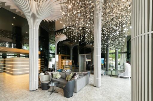 Modern lobby with stylish seating and unique lighting fixtures