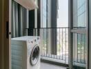 Laundry area with washing machine and expansive city view