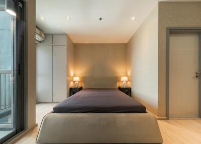 Modern bedroom with double bed and ambient lighting