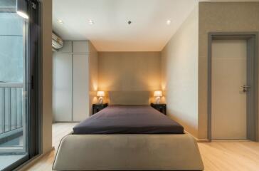 Modern bedroom with double bed and ambient lighting