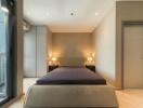 Modern bedroom with double bed and ambient lighting