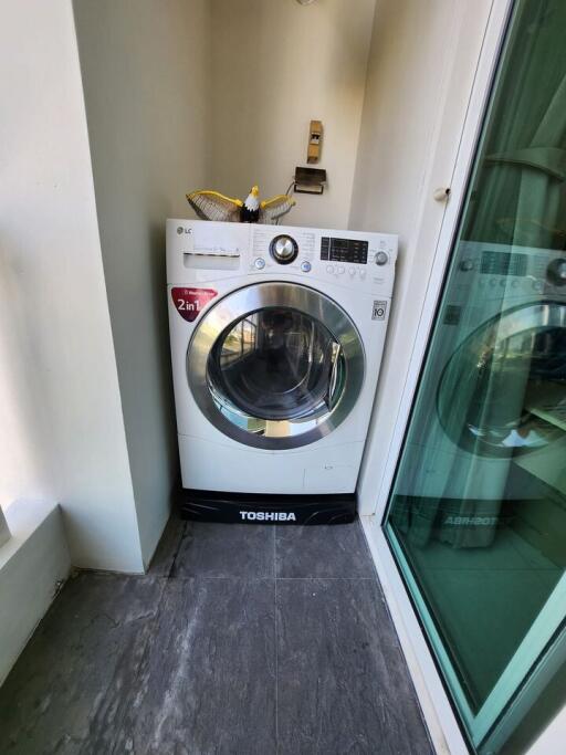 Modern laundry area with a front-loading washer