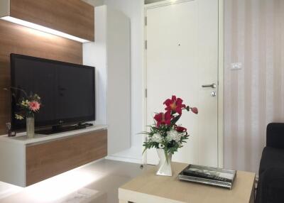 Modern living room with TV and flower decorations