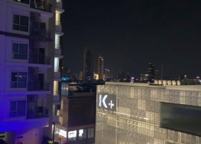 Night view of buildings with illuminated swimming pool