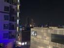 Night view of buildings with illuminated swimming pool